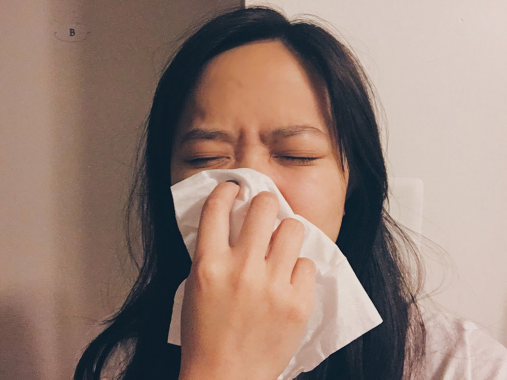 woman-sneezing